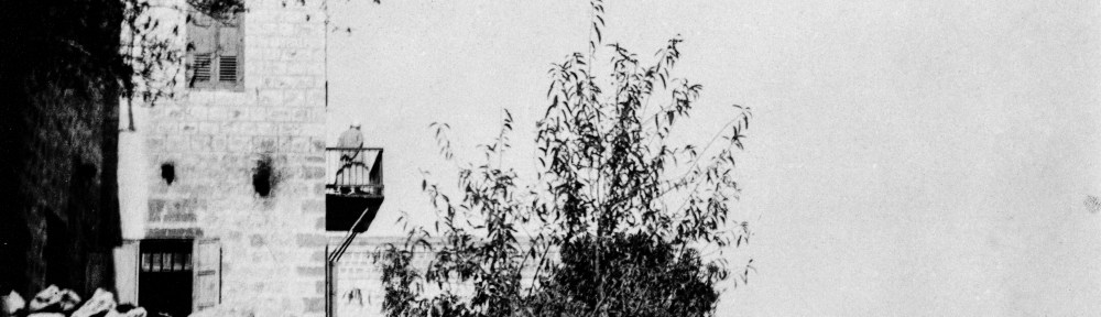 ‘Abdu’l-Bahá standing on the balcony of the house of Abbas Gholi, c. 1920