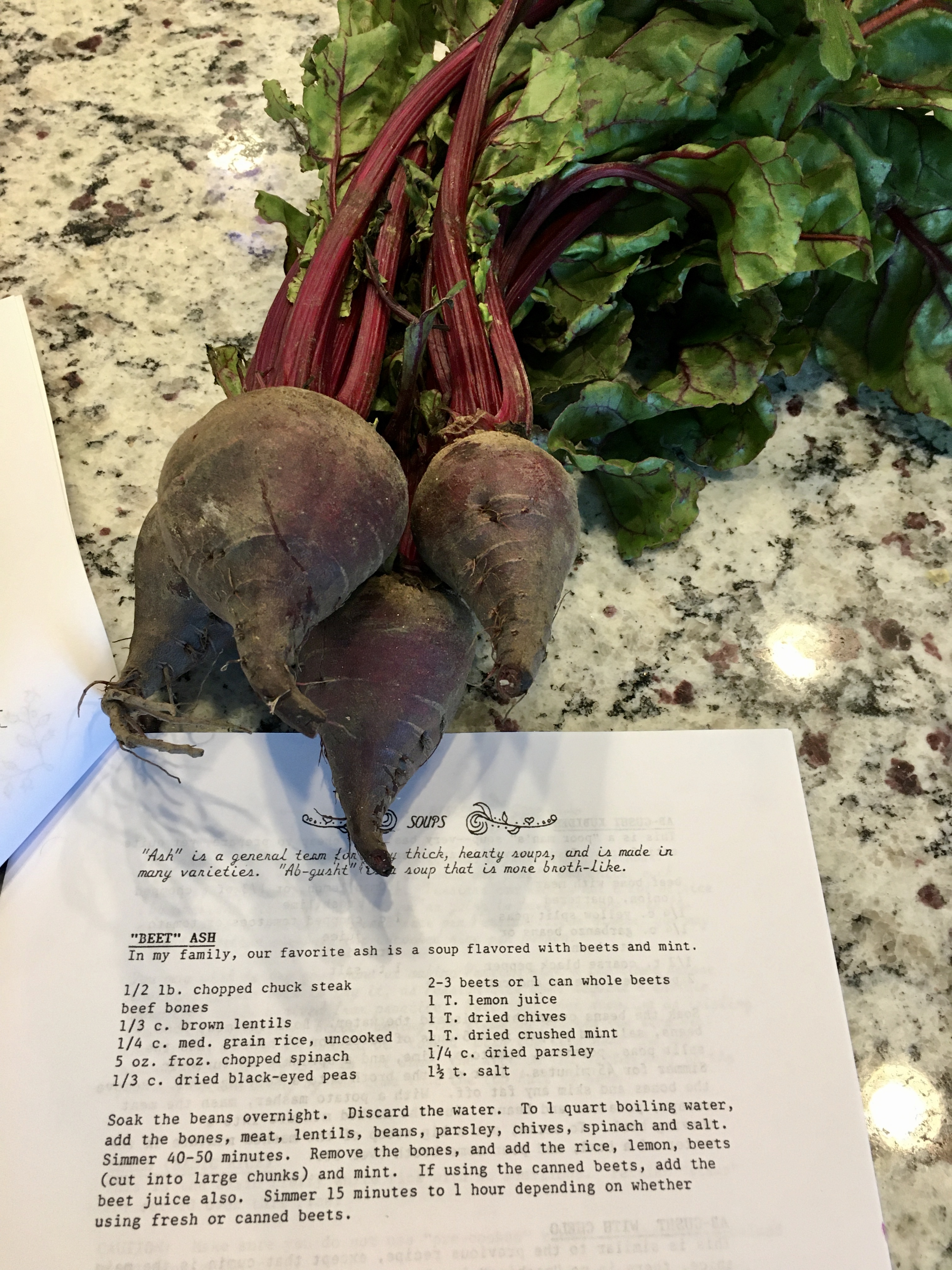 Four beets on top of printed recipe