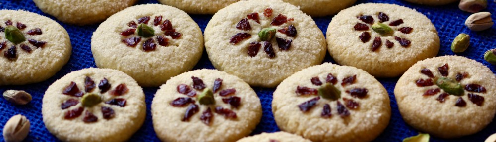 Rice cookies decorated with pistachios and dried cranberries
