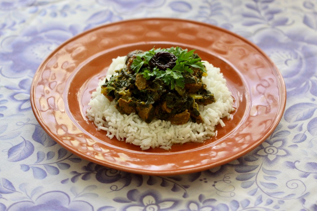 Spinach stew on rice