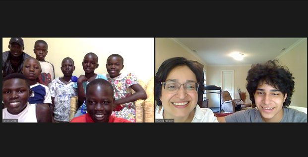 Participants on a video call smile at each other.