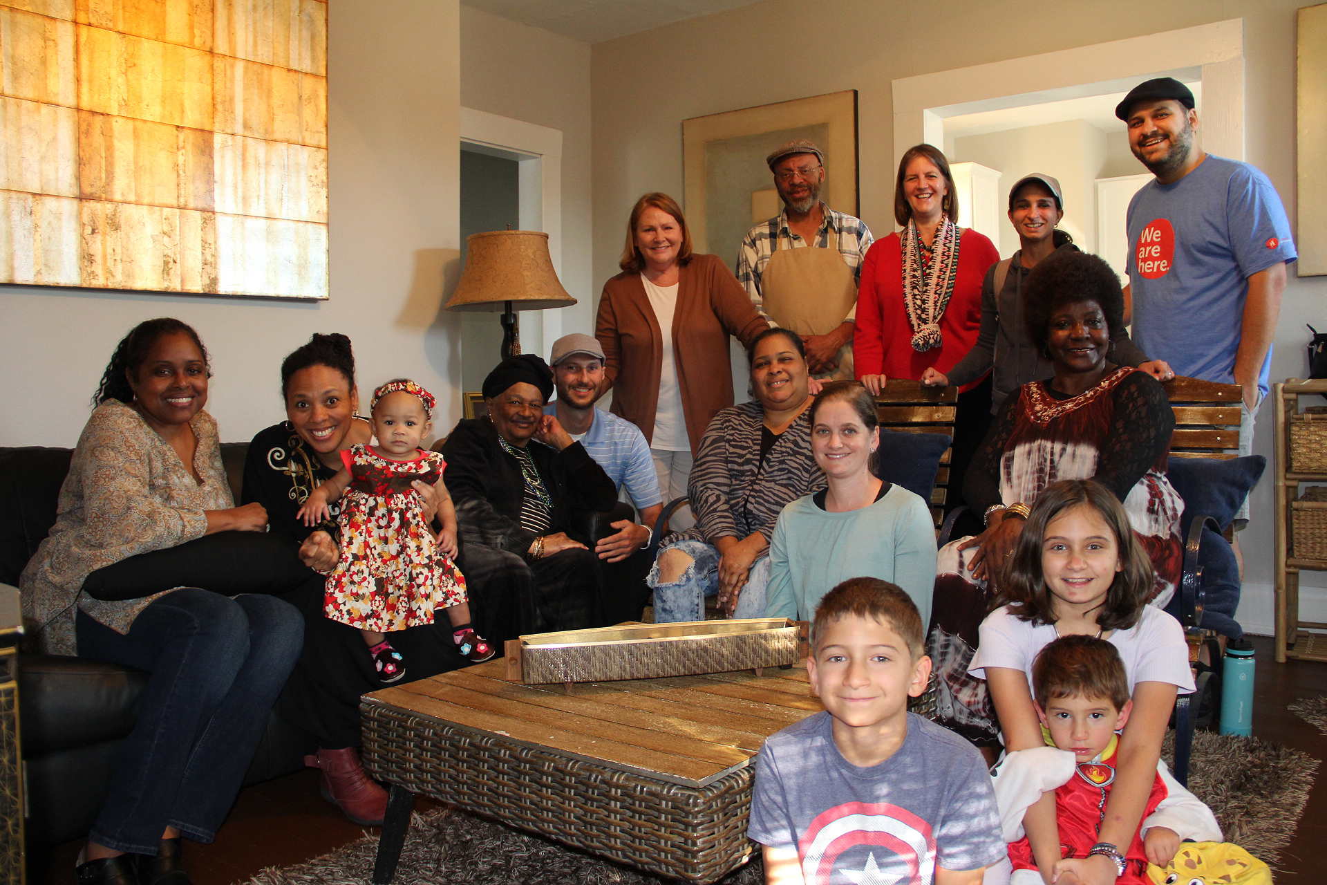 Sixteen people at a gathering.