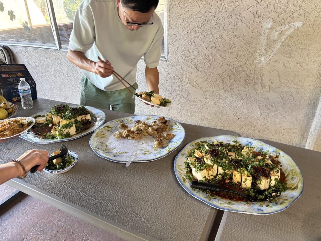 A man serves himself from a buffet.
